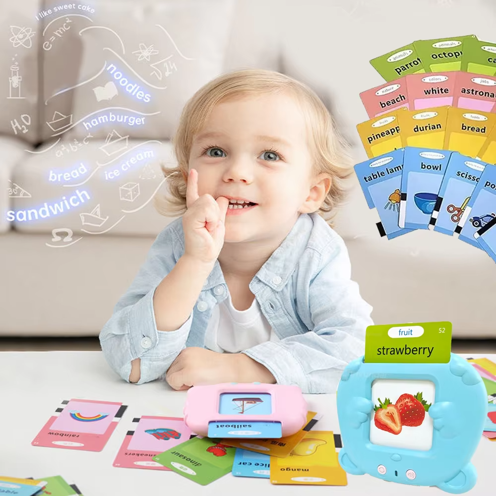Child with colourful talking flashcards and pink and blue card readers